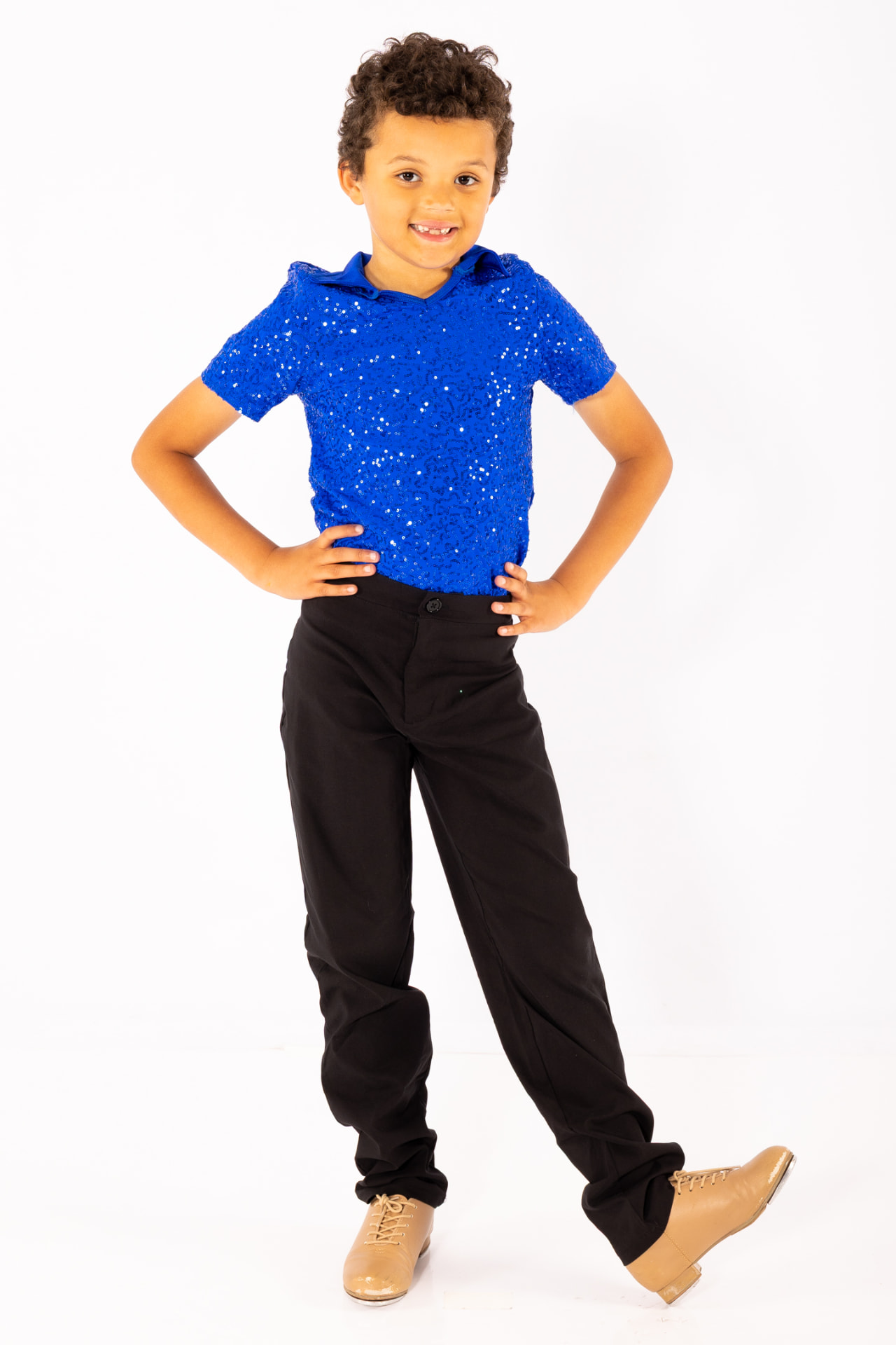 A young tap dancer in a blue costume