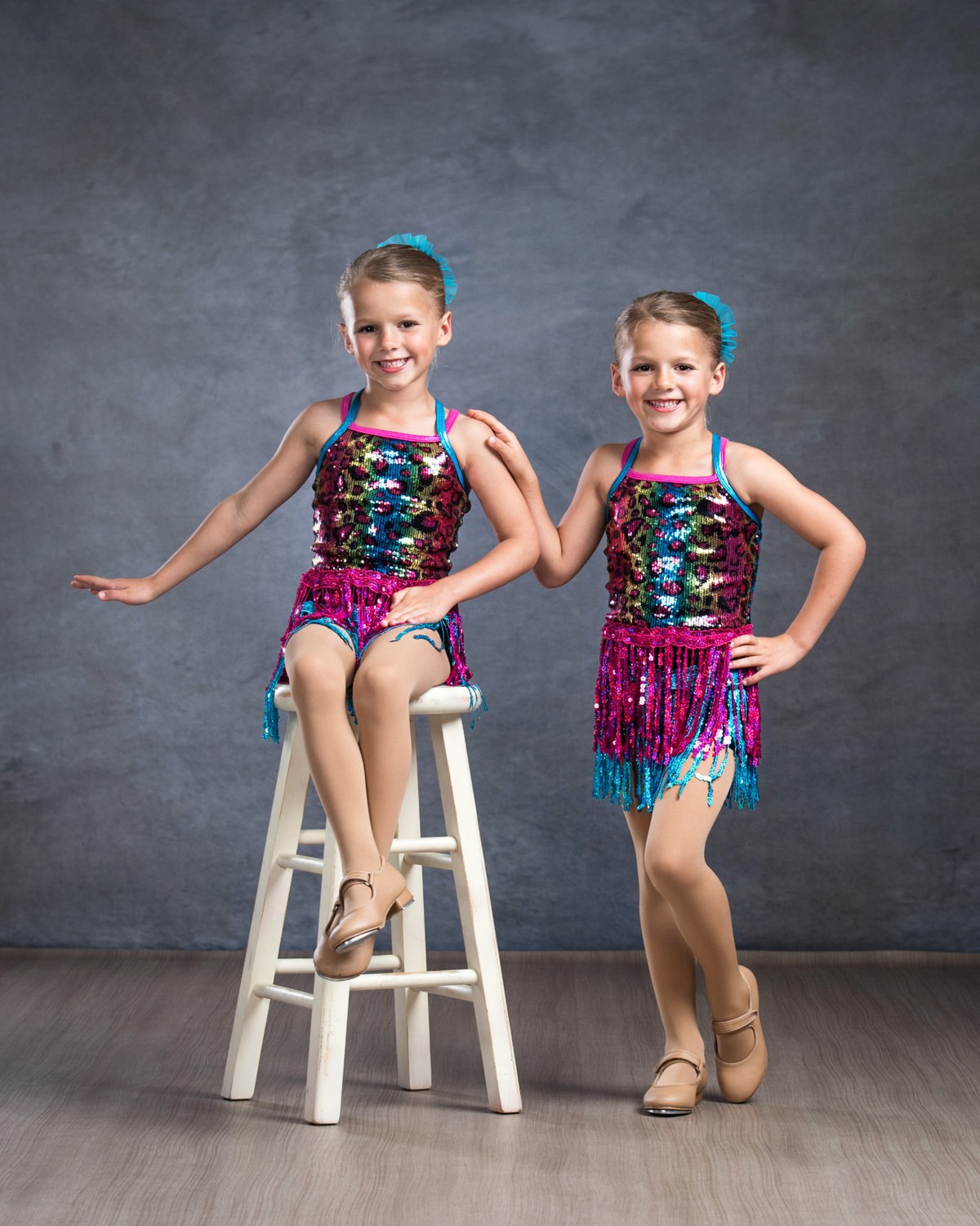 Two young tap dancers smiling together