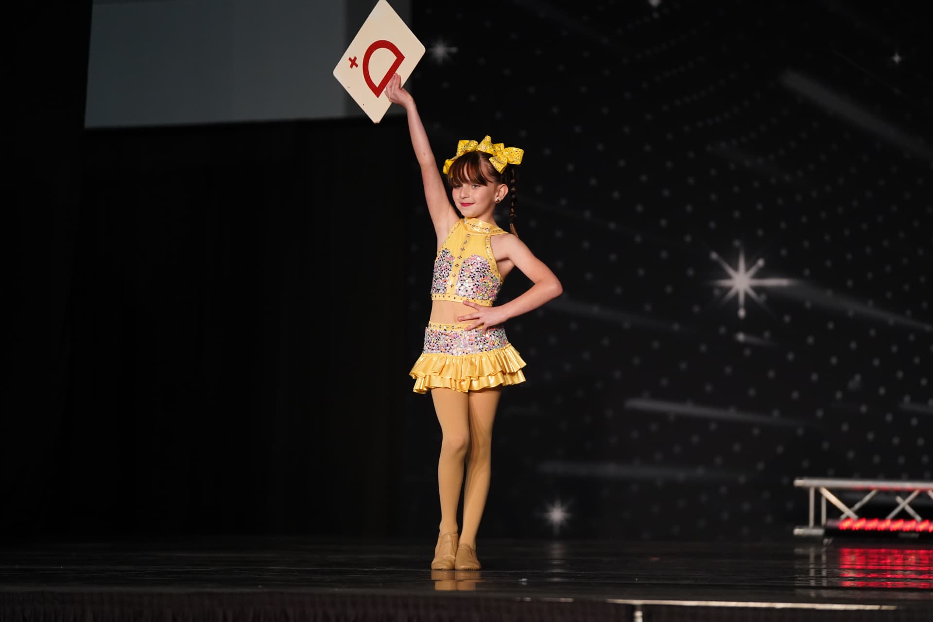 A Music in Motion dancer mid performance on stage