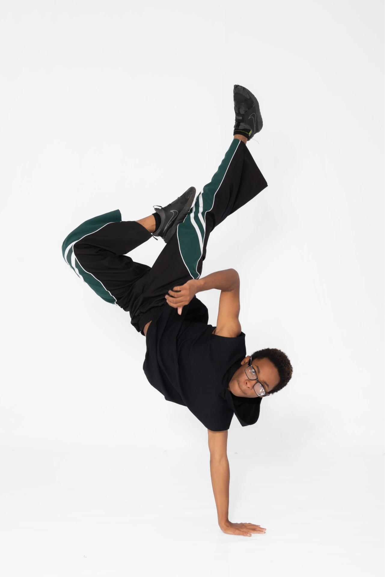 A Music in Motion hip-hop dancer mid-freeze in the studio