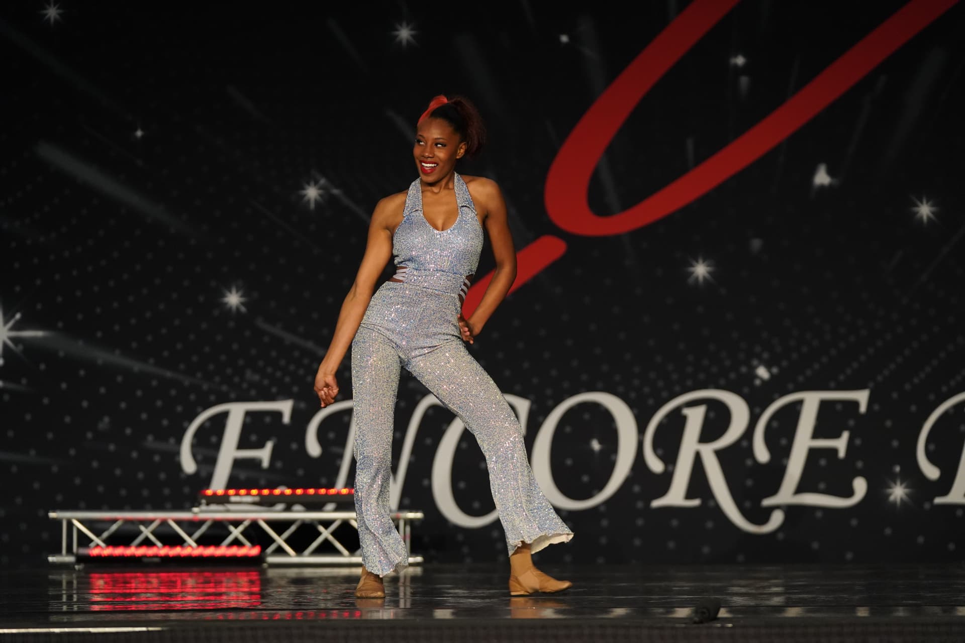 A Music in Motion dancer on stage at the spring recital