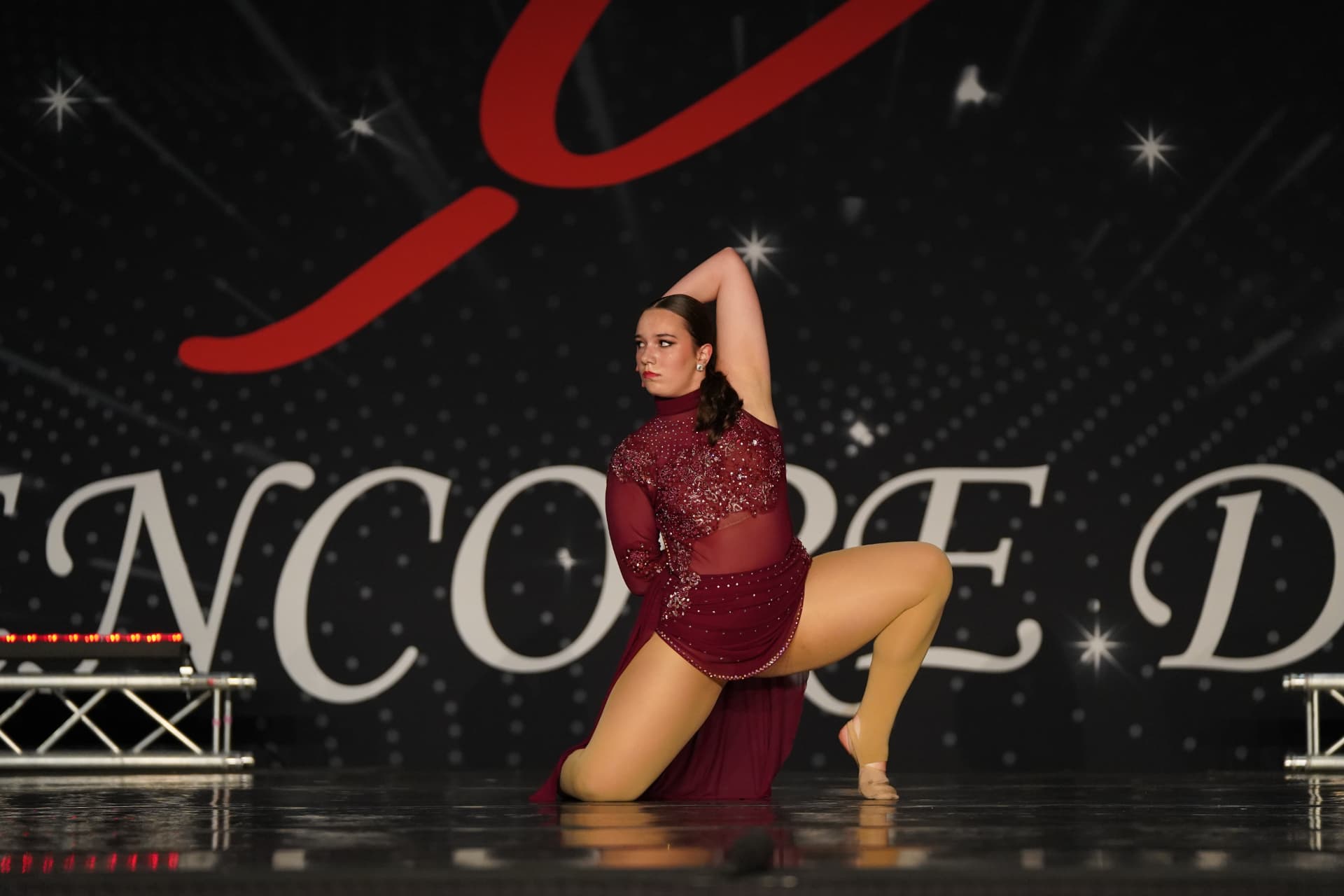 A Music in Motion dancer performing a solo on stage