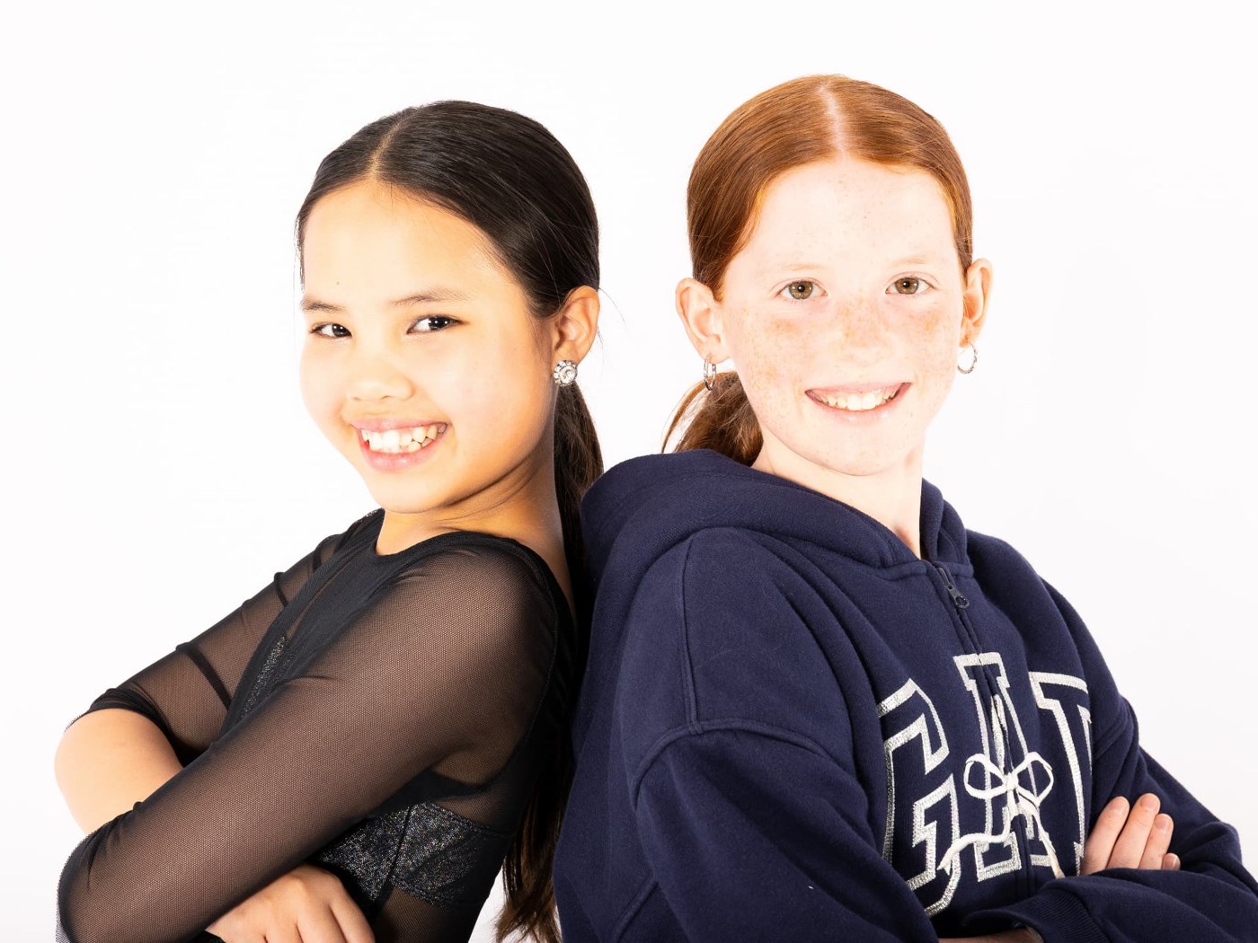 Two dance friends smiling together