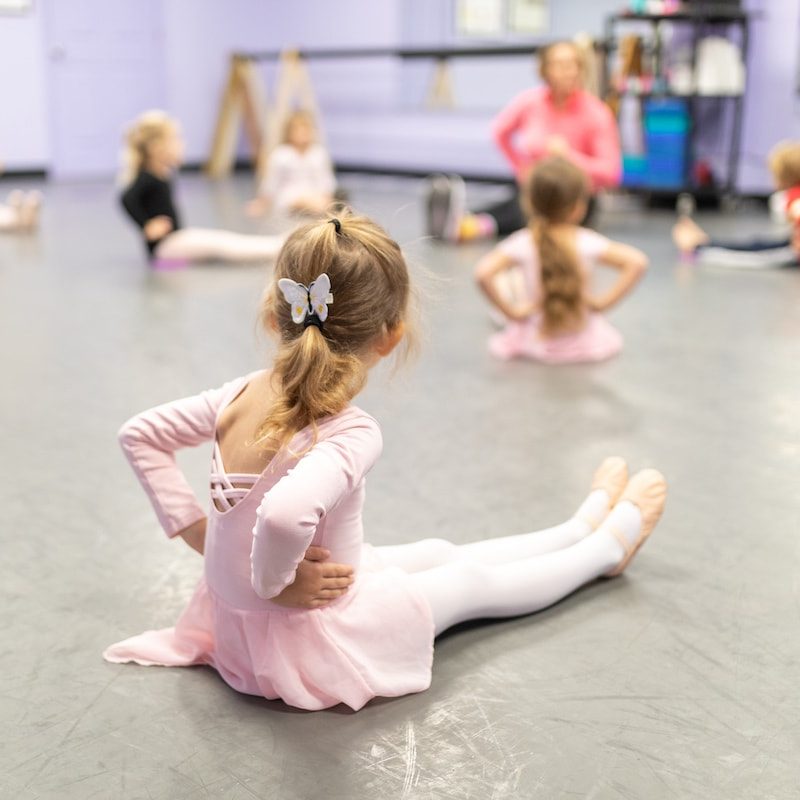 preschool dancer listening to teacher
